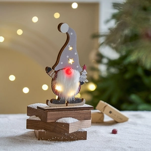 LED lighted Christmas wooden gnome ornament with glowing stars and skiing base design
