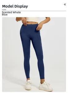 Detail view of high-waisted yoga leggings in whale blue with supportive structural seams