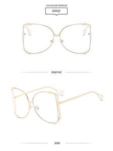 Detail view of gold metal square frame sunglasses with luxury pearl temple accents