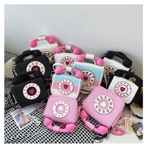 Detailed collection of retro telephone handbags in multiple colors on a stylish background