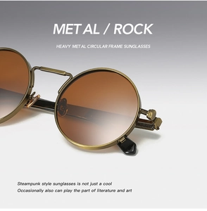 Detail view of steampunk round sunglasses showing metal spring bridge and screw hinge texture