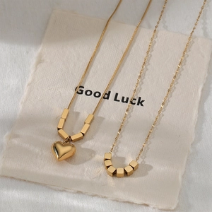 Minimalist gold stainless steel necklace with heart pendant and square beads on snake chain