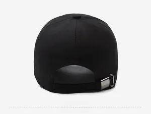 Detail view of the black baseball cap showing the cotton fabric and metal back buckle