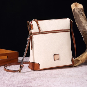 Vintage off-white litchi grain crossbody bag with brown leather trim and metal plate