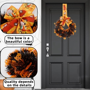 Detail of Halloween wreath featuring orange pumpkin bow and black tinsel material