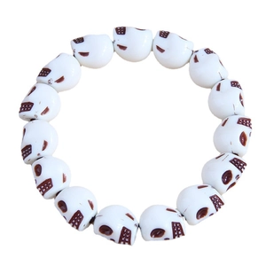 Fashionable white ceramic skull beads bracelet with brown details on a clean white background