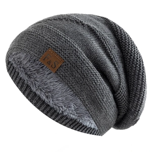 Close-up of thick fleece lining and knitted texture on a warm winter beanie hat