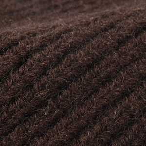 Thick warm dark brown ribbed knit beanie with soft plush texture for winter outdoor wear