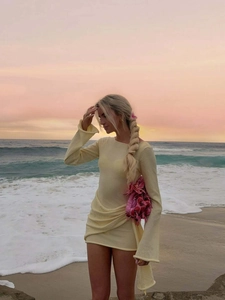 Fashionable pale yellow knitted long sleeve mini dress with ruching for beach vacation