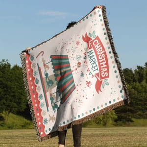 Detail of bohemian Christmas tree throw blanket with reindeer patterns and festive fringes