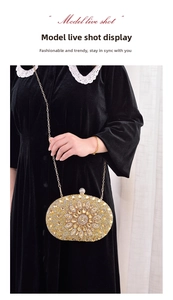 Detailed view of luxury evening clutch bag with gold rhinestones and floral crystal pattern