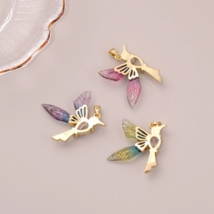Golden hummingbird pendant with gradient colorful wings and heart-shaped zircon crystal