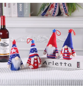 Detail of four patriotic gnome plush dolls with red white blue stars and striped patterns
