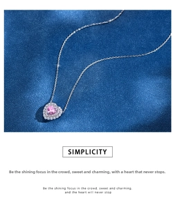 Detail of S925 silver necklace with pink heart-shaped gemstone in halo diamond setting