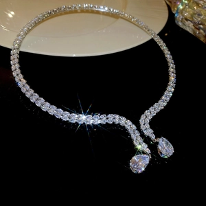 Detailed close-up of a silver zircon choker necklace with double teardrop pendants