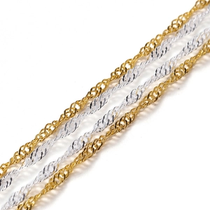 Detailed view of twisted water wave chains in gold and silver finishes for DIY jewelry