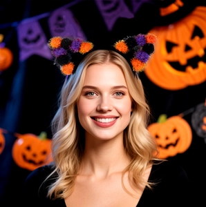 Close-up of Halloween cat ear headband with colorful pom poms on a model