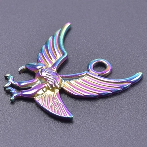 Detailed macro view of a colorful rainbow stainless steel eagle pendant for DIY jewelry