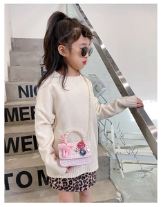 Pink tweed girls' crossbody bag with pearl handle and plush rabbit charm detail