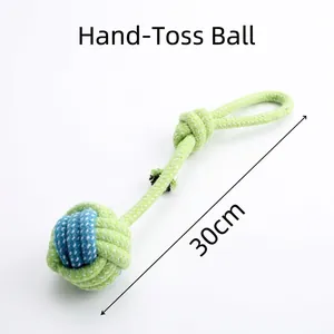 Detail of 30cm green and blue cotton rope dog toy with ball knot and hand loop