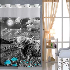 Detail of waffle weave shower curtain with highland cow print and blue daisy accents