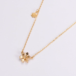 Golden snowflake pendant necklace with cubic zirconia on a minimalist chain for women