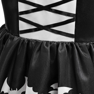 Detail of Halloween girl's dress with corset style ribbon and white bat pattern print