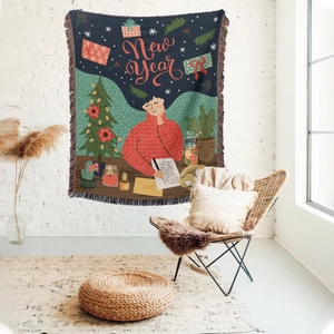 Detail of woven Christmas tapestry with New Year illustration and soft fringe edges
