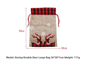 Detail view of burlap Christmas gift bag featuring reindeer patterns and dimensions 56x38cm