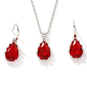 Exquisite luxury jewelry set featuring red teardrop pendant necklace and stud earrings