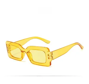 Detail view of model C15 rectangular sunglasses with transparent yellow frames and lenses