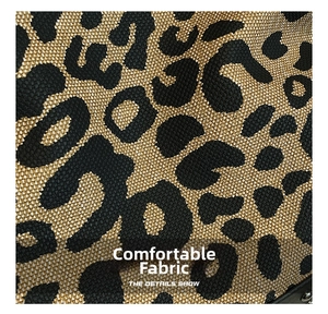 Close-up of leopard print jacquard fabric with durable golden fibers and rivet detail