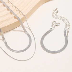 Detail view of silver snake bone chain necklace set with elegant layered structure