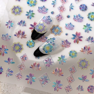 Holographic gold butterfly floral nail stickers with glitter finish on black French nails
