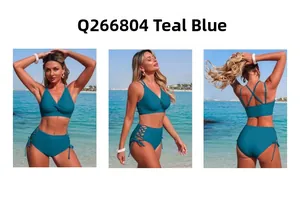 Detail view of teal two-piece swimsuit featuring V-neck twist top and lace-up high waist bottoms