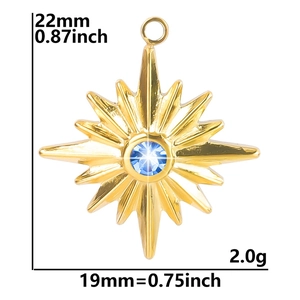 Detailed view of gold star pendant with blue crystal including size measurements