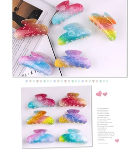 Detailed close-up of colorful gradient starfish and shell hair clips in a stylish layout