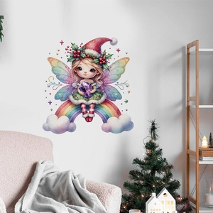 Detail of Christmas fairy wall sticker with rainbow wings on white wall in a cozy room