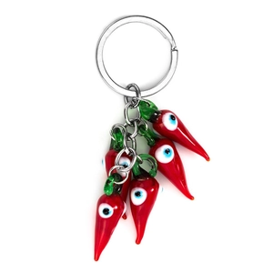 Red chili pepper keychain with Evil Eye patterns on a metallic ring and chain link
