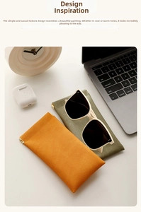 Detail of pebbled texture orange and olive sunglasses pouches with squeeze metal closure