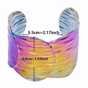 Macro detail of iridescent titanium steel cuff bracelet showing width and height measurements