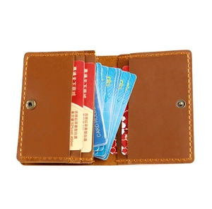 Detailed view of brown crazy horse leather card wallet with multi-slot interior and stitching