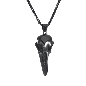 Close-up of black punk titanium steel raven skull pendant necklace on white background