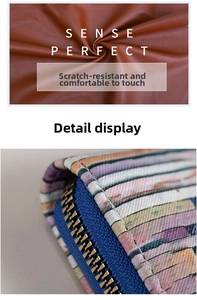 Detail view of brown textured leather with colorful printed pattern and metal zipper