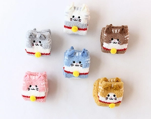 Close-up of cat-themed coral fleece socks in various colors with small bell details