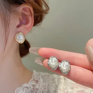 French vintage baroque pearl stud earrings with irregular gold and silver wave borders