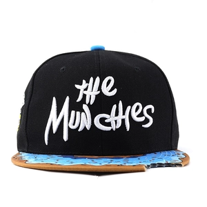 Detail of flat brim baseball cap with donut frosting print and a unique bite-mark notch