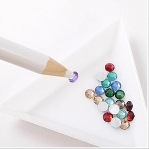 DIY rhinestone applicator pen with colorful multi-faceted gems and white sorting tray