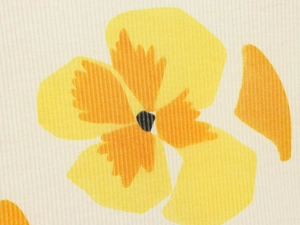 Close-up of yellow floral print on textured fabric showing fine fiber details