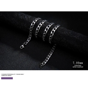 Detail view of 7mm silver stainless steel Cuban link chain with a sturdy lobster clasp